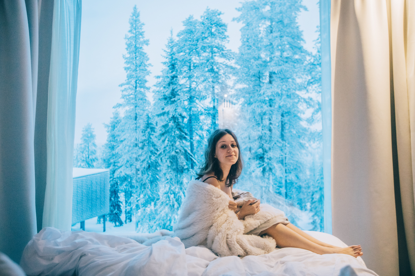 girl, northern lights, arctic treehouse hotel, finland best hotels